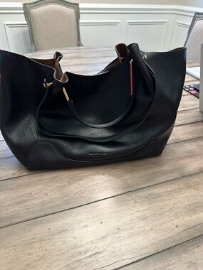 Sondra Robert’s black hobo slouchy handbag with gold accents